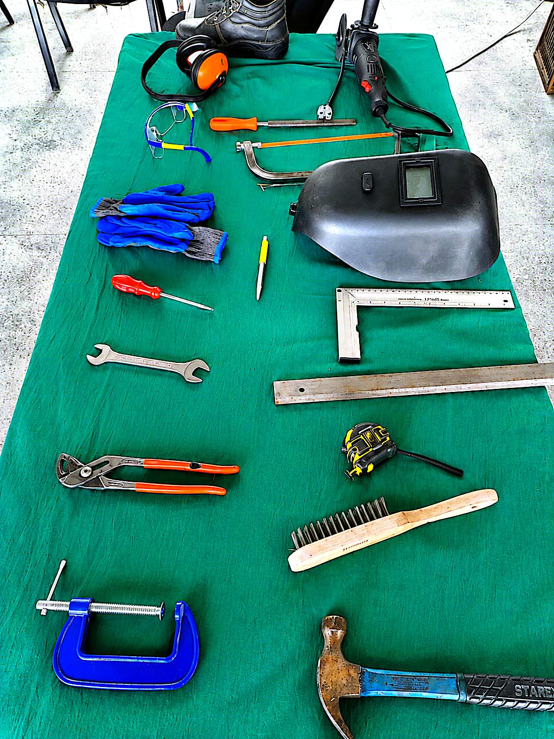 Hand tools and PPE laid out for practical demonstrations