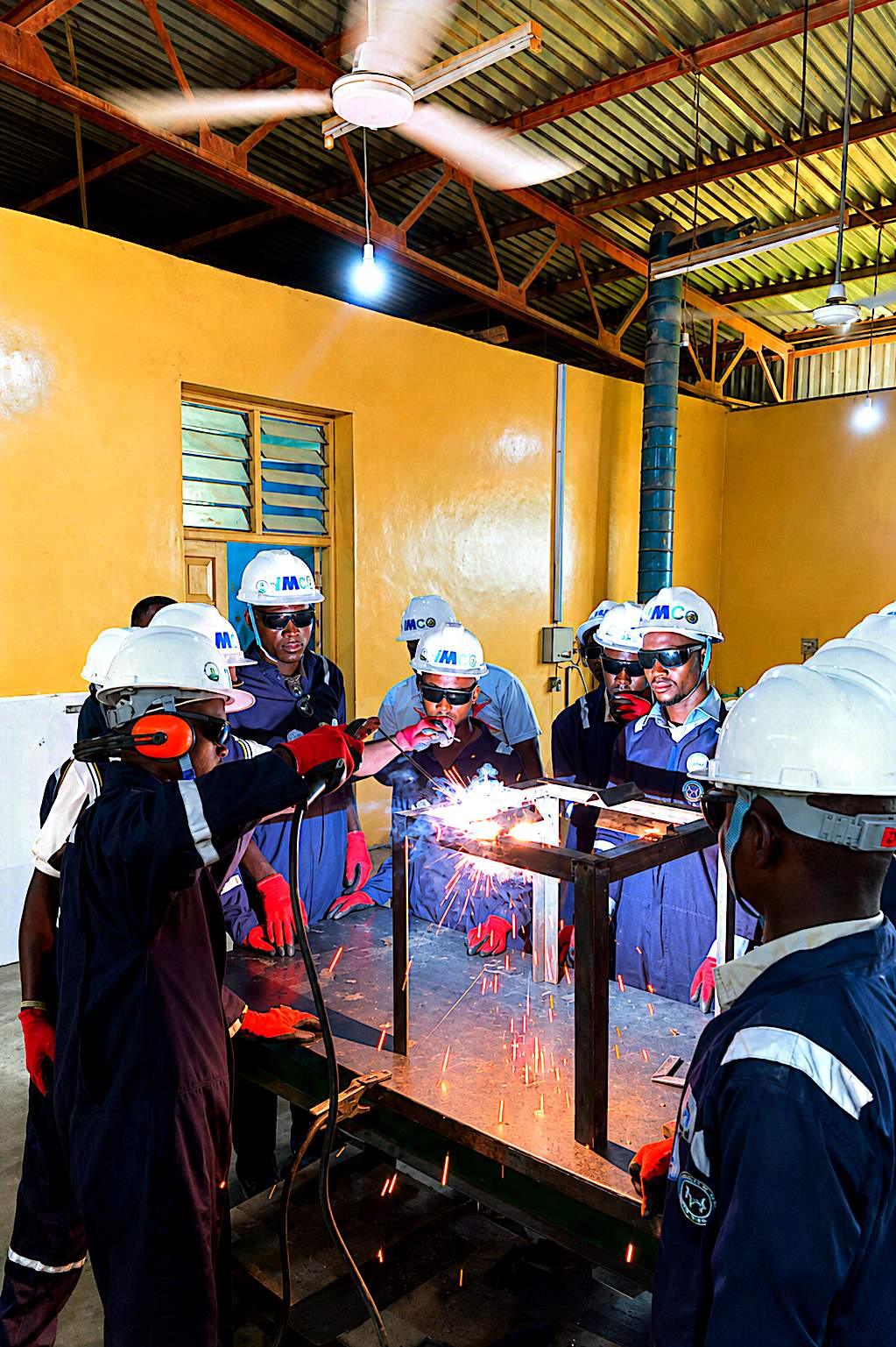 Group welding practice on a fabricated steel table